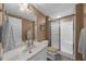 Clean bathroom featuring a shower with glass door, white vanity, and neutral color scheme at 340 Helens Manor Dr, Lawrenceville, GA 30045