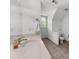 Bright bathroom with single sink vanity, tile floors, and white walls at 340 Helens Manor Dr, Lawrenceville, GA 30045