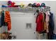 Organized closet space featuring a shelf with clothes, hats, and plush toys adding a playful, personal touch at 340 Helens Manor Dr, Lawrenceville, GA 30045
