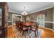 Formal dining room featuring hardwood floors, chandelier and traditional decor at 340 Helens Manor Dr, Lawrenceville, GA 30045