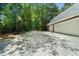 Long driveway leading to a three-car garage and tennis net at 340 Helens Manor Dr, Lawrenceville, GA 30045