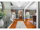 Elegant foyer with hardwood floors, a staircase, and a glimpse of the formal dining area at 340 Helens Manor Dr, Lawrenceville, GA 30045