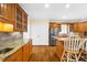 Stylish kitchen featuring granite countertops, stainless steel appliances and hardwood floors at 340 Helens Manor Dr, Lawrenceville, GA 30045