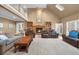 Spacious living room with vaulted ceilings, fireplace, built-in bookshelves and french doors at 340 Helens Manor Dr, Lawrenceville, GA 30045