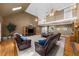 Spacious living room featuring a fireplace, vaulted ceiling, skylight and hardwood flooring at 340 Helens Manor Dr, Lawrenceville, GA 30045