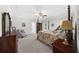 Comfortable bedroom featuring a four-poster bed, ceiling fan, and ample natural light at 340 Helens Manor Dr, Lawrenceville, GA 30045