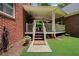 Cozy porch with outdoor seating and a view of the landscaped yard at 340 Helens Manor Dr, Lawrenceville, GA 30045