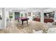 Basement rec room with pool table, bar area, hardwood floors and access to the backyard at 7025 Windsor Hill Psge, Suwanee, GA 30024