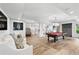 Basement with open layout including pool table, bar area, hardwood floors and modern lighting at 7025 Windsor Hill Psge, Suwanee, GA 30024
