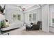 Bright bedroom with two windows, a comfortable chair, and a serene atmosphere at 7025 Windsor Hill Psge, Suwanee, GA 30024