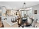 Bright dining area with stylish chandelier, opens to the modern kitchen at 7025 Windsor Hill Psge, Suwanee, GA 30024