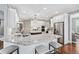 Open-concept kitchen with granite countertops, island with seating and stainless steel appliances at 7025 Windsor Hill Psge, Suwanee, GA 30024