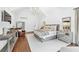 Bright main bedroom with tall, vaulted ceiling features modern decor and furnishings at 7025 Windsor Hill Psge, Suwanee, GA 30024