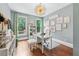 Bright home office features hardwood floors, natural light, and charming decorative accents at 7025 Windsor Hill Psge, Suwanee, GA 30024