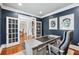 Comfortable office featuring French doors, a spacious desk, and natural light at 7025 Windsor Hill Psge, Suwanee, GA 30024