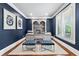 Stylish office with built-in shelving, plantation shutters, fresh paint and hardwood floors at 7025 Windsor Hill Psge, Suwanee, GA 30024