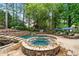 Backyard oasis featuring a stunning pool, waterfall features, and lounge area at 7025 Windsor Hill Psge, Suwanee, GA 30024