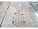 Luxurious glass enclosed shower features dual shower heads and elegant marble tiling at 7025 Windsor Hill Psge, Suwanee, GA 30024