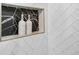 Herringbone-tiled shower niche with marble slab adds luxury to this modern bathroom at 7025 Windsor Hill Psge, Suwanee, GA 30024
