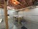 Unfinished basement space with exposed ceiling, concrete flooring, table, and walls at 810 Doe Hill Ln, Roswell, GA 30075