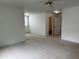 Expansive bedroom with neutral carpet, ceiling fan and plenty of natural light at 810 Doe Hill Ln, Roswell, GA 30075