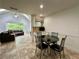 Open dining area with vaulted ceiling and modern furnishings at 810 Doe Hill Ln, Roswell, GA 30075