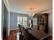 Dining room featuring large window, chandelier and seating for six at 810 Doe Hill Ln, Roswell, GA 30075