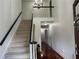Inviting foyer with hardwood floors, staircase, and a chandelier at 810 Doe Hill Ln, Roswell, GA 30075