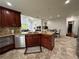 Modern kitchen with stainless steel appliances, island with seating, and stylish cabinets at 810 Doe Hill Ln, Roswell, GA 30075