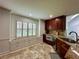 Eat-in kitchen featuring granite countertops and ample storage space at 810 Doe Hill Ln, Roswell, GA 30075