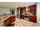 Kitchen with stainless steel appliances, granite countertops, and custom cabinetry at 810 Doe Hill Ln, Roswell, GA 30075