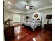 Elegant main bedroom with hardwood floors and tray ceiling at 810 Doe Hill Ln, Roswell, GA 30075