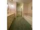 Bathroom featuring a vanity with sink, tub, and shower, providing a complete bathing experience at 1165 Vineyard Ct, Stone Mountain, GA 30083