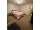 Bedroom features a queen bed with simple lighting at 1165 Vineyard Ct, Stone Mountain, GA 30083