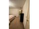 Spacious bedroom with carpet flooring and a black dresser at 1165 Vineyard Ct, Stone Mountain, GA 30083
