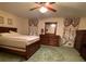 Spacious bedroom with a bed, dresser with mirror, and floral curtains at 1165 Vineyard Ct, Stone Mountain, GA 30083