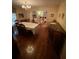 Inviting dining room area with hardwood floors, a formal dining table, and seamless connection to the living room at 1165 Vineyard Ct, Stone Mountain, GA 30083