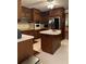 Traditional-style kitchen with an island, white countertops, and stainless steel appliances at 1165 Vineyard Ct, Stone Mountain, GA 30083