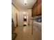 A well-lit laundry room equipped with a washer, dryer, sink, and cabinet space, perfect for managing laundry tasks at 1165 Vineyard Ct, Stone Mountain, GA 30083