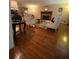 Spacious living room featuring a fireplace, hardwood floors, and stylish furniture, perfect for relaxation and entertainment at 1165 Vineyard Ct, Stone Mountain, GA 30083