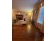 Cozy living room featuring hardwood floors, a fireplace, and large windows, providing natural light and a comfortable atmosphere at 1165 Vineyard Ct, Stone Mountain, GA 30083