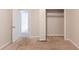 Bedroom features a neutral paint scheme and closet with shelves at 1282 Shiloh Trail E, Kennesaw, GA 30144
