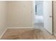 Empty bedroom with neutral paint, beige carpet and view to the next room at 1282 Shiloh Trail E, Kennesaw, GA 30144