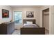 Neutral-toned bedroom with gray furnishings, artwork, and closet space at 1282 Shiloh Trail E, Kennesaw, GA 30144