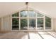 Bedroom featuring vaulted ceiling and an oversized window with green tree views at 1282 Shiloh Trail E, Kennesaw, GA 30144