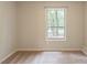 This bedroom has neutral colored walls, carpet and a window that provides natural light at 1282 Shiloh Trail E, Kennesaw, GA 30144