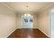Dining room with hardwood floors and modern lighting. View to sunroom at 1282 Shiloh Trail E, Kennesaw, GA 30144