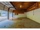 Spacious garage interior with exposed wood beams and room for multiple vehicles at 1282 Shiloh Trail E, Kennesaw, GA 30144