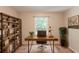 Cozy home office featuring a rustic desk, bookshelf, and large window at 1282 Shiloh Trail E, Kennesaw, GA 30144