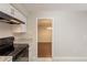 This kitchen offers a granite countertop and tile flooring at 1282 Shiloh Trail E, Kennesaw, GA 30144